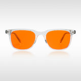 Blue light blockers with orange lenses and clear frame on a white background