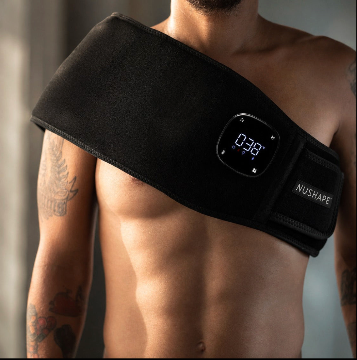 Man wearing the Therapy Wrap Pulse across the shoulder and chest, controller showing session time